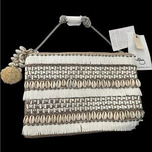 Antik Bstik Castaway crossbody/clutch featuring cowrie shells & mirrored beads.